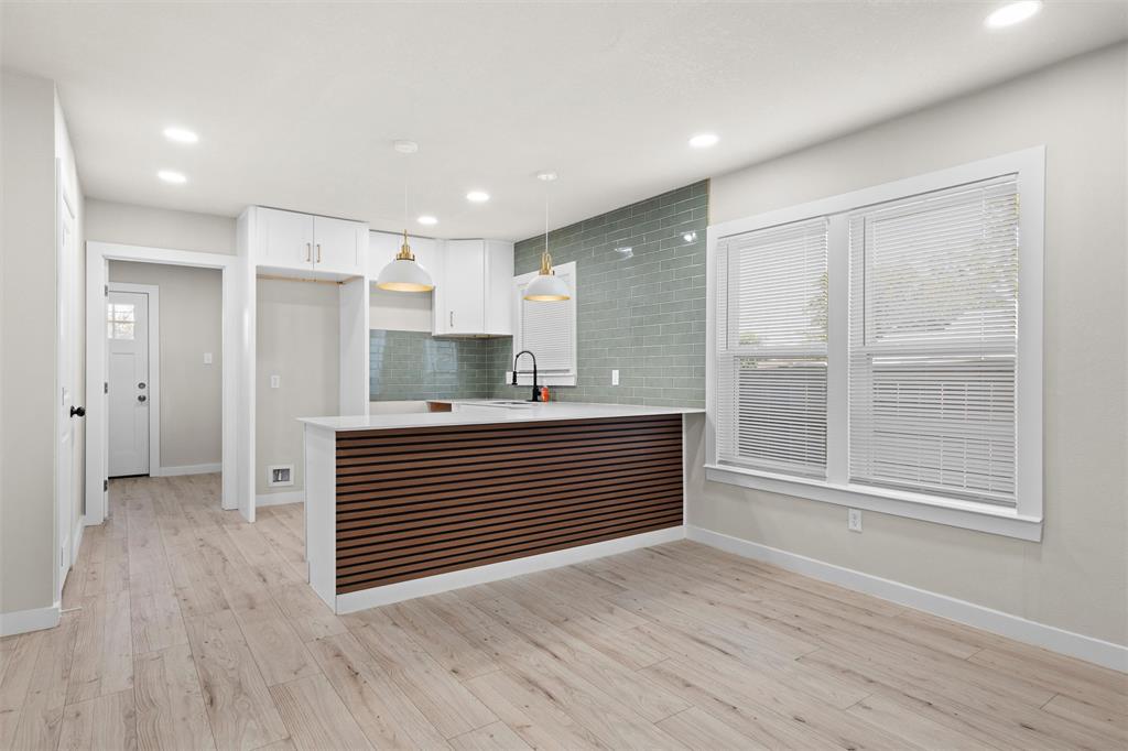 1300 East Baltimore Avenue Fort Worth, TX 76104 - Photo 6 of 25 a view of kitchen with wooden floor
