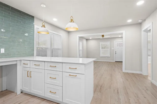 a view of cabinets with wooden floor
