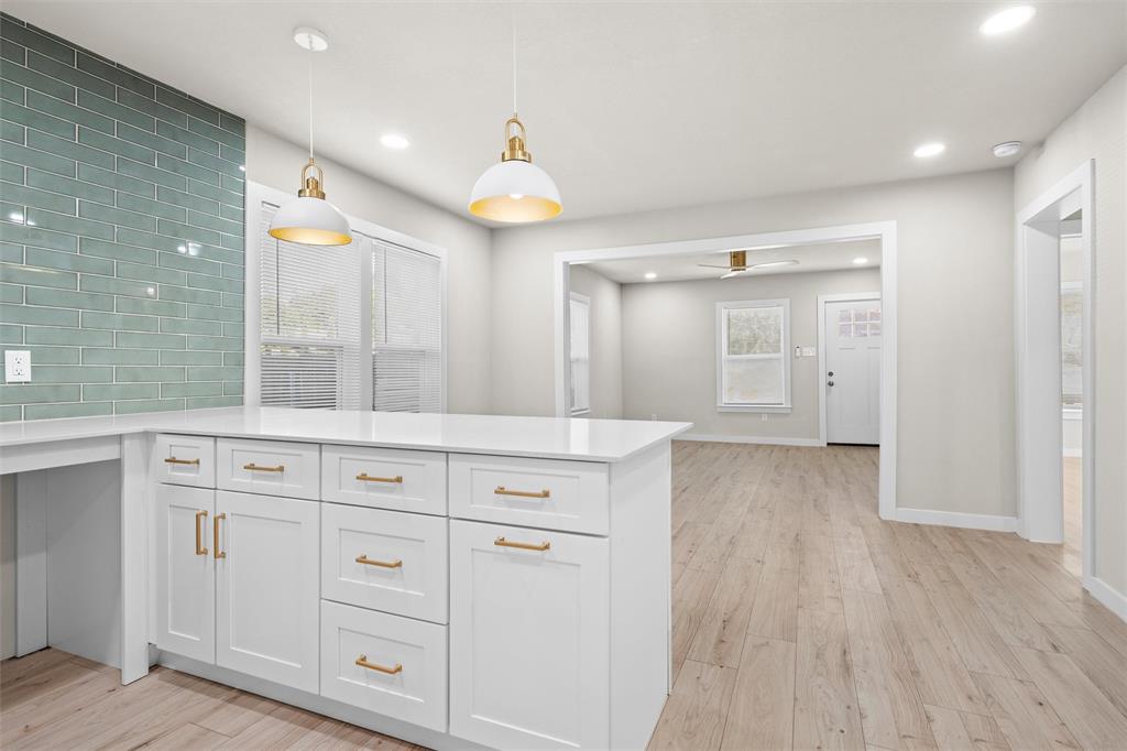 1300 East Baltimore Avenue Fort Worth, TX 76104 - Photo 7 of 25 a view of cabinets with wooden floor