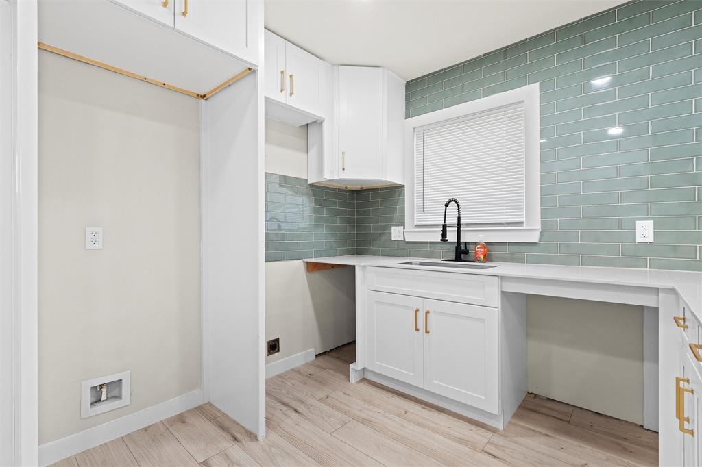 1300 East Baltimore Avenue Fort Worth, TX 76104 - Photo 8 of 25 a kitchen with a sink cabinets and wooden floor