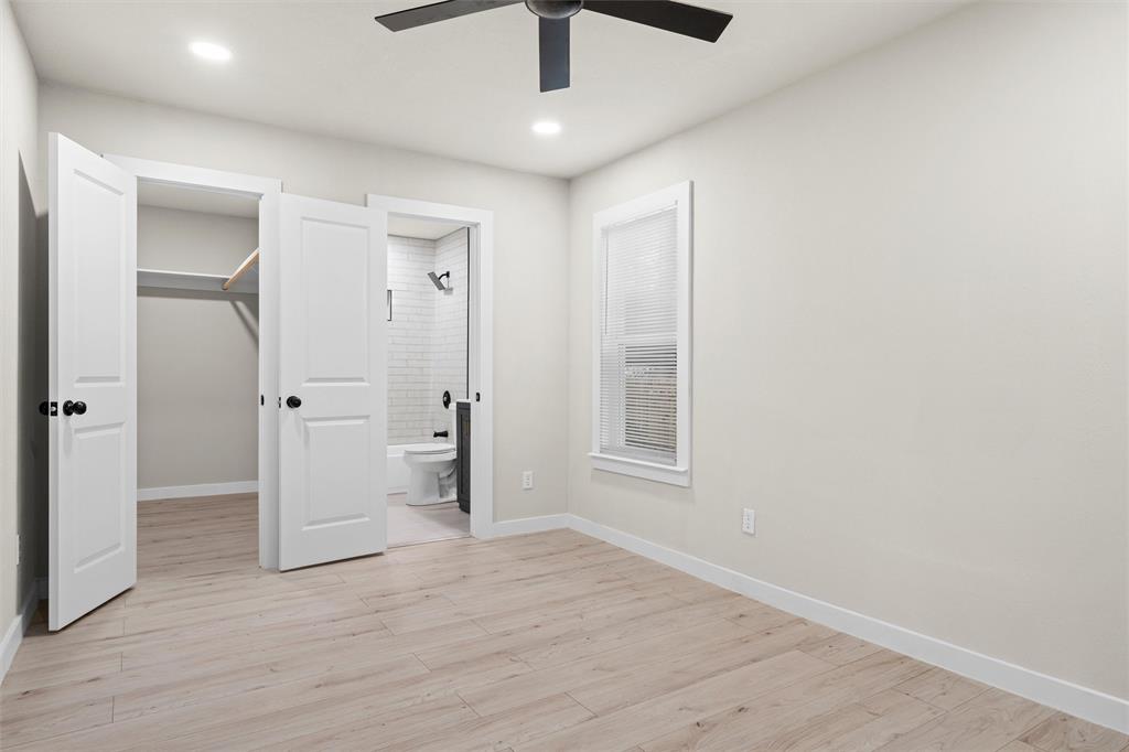 1300 East Baltimore Avenue Fort Worth, TX 76104 - Photo 10 of 25 wooden floor in an empty room with a window