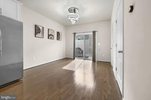 a view of deck with table and chairs and wooden floor