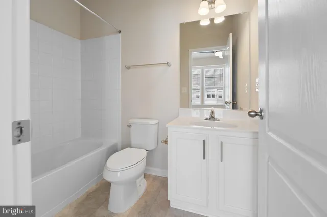 a kitchen with stainless steel appliances a refrigerator sink and microwave