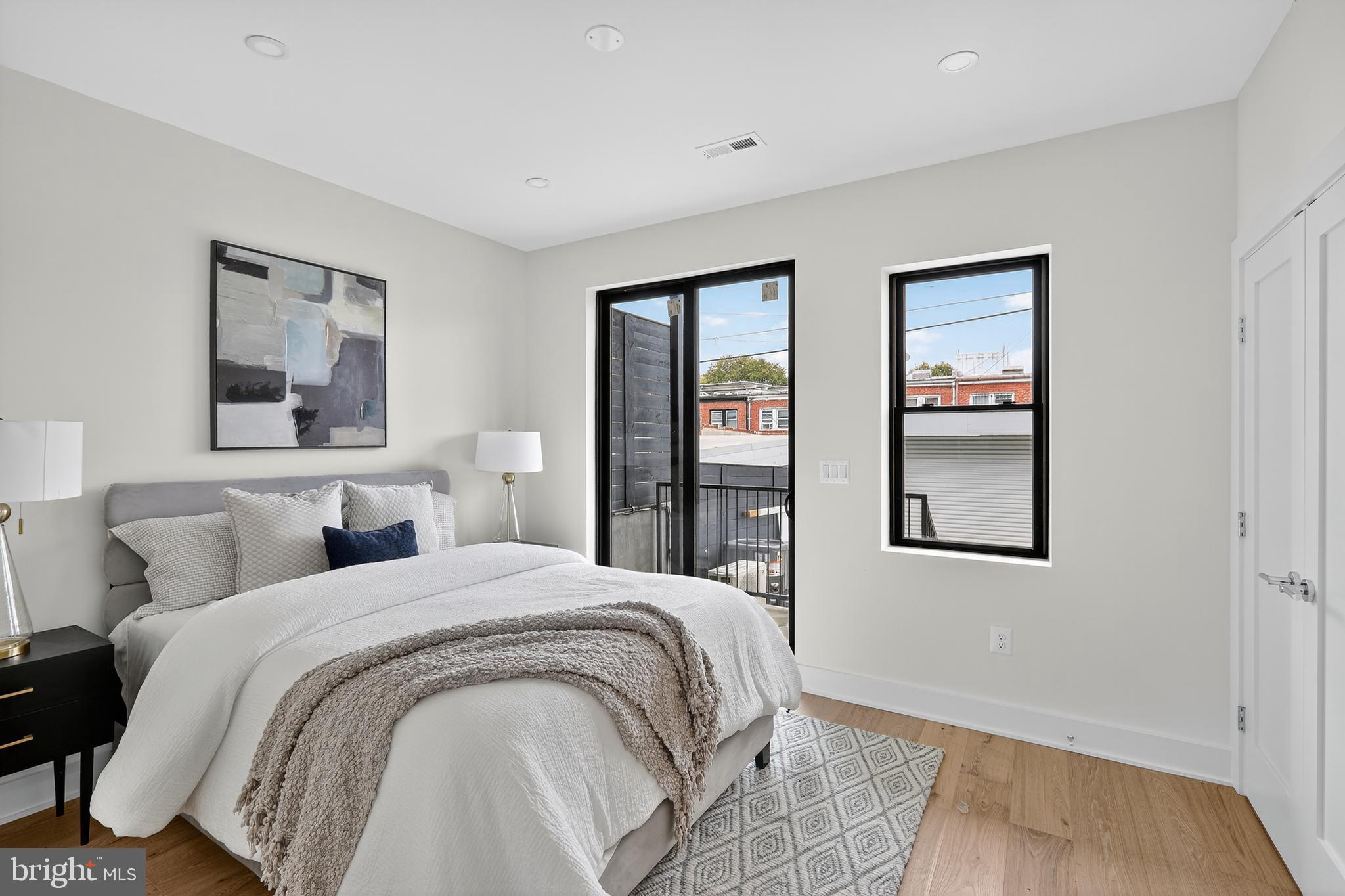 828 21st Street Northeast, Unit 1 Washington, DC 20002 - Photo 17 of 30 a bedroom with double bed and a window