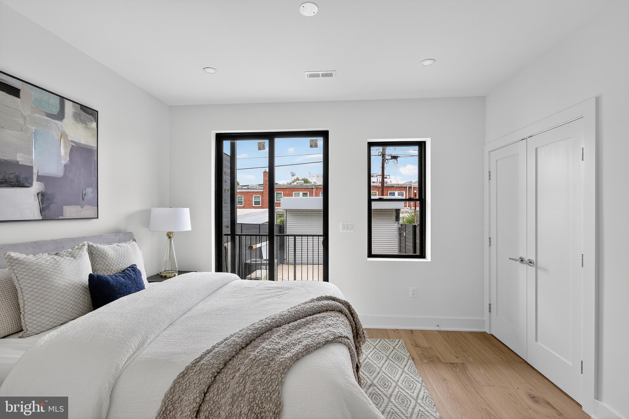 828 21st Street Northeast, Unit 1 Washington, DC 20002 - Photo 18 of 30 a bedroom with a bed and a window