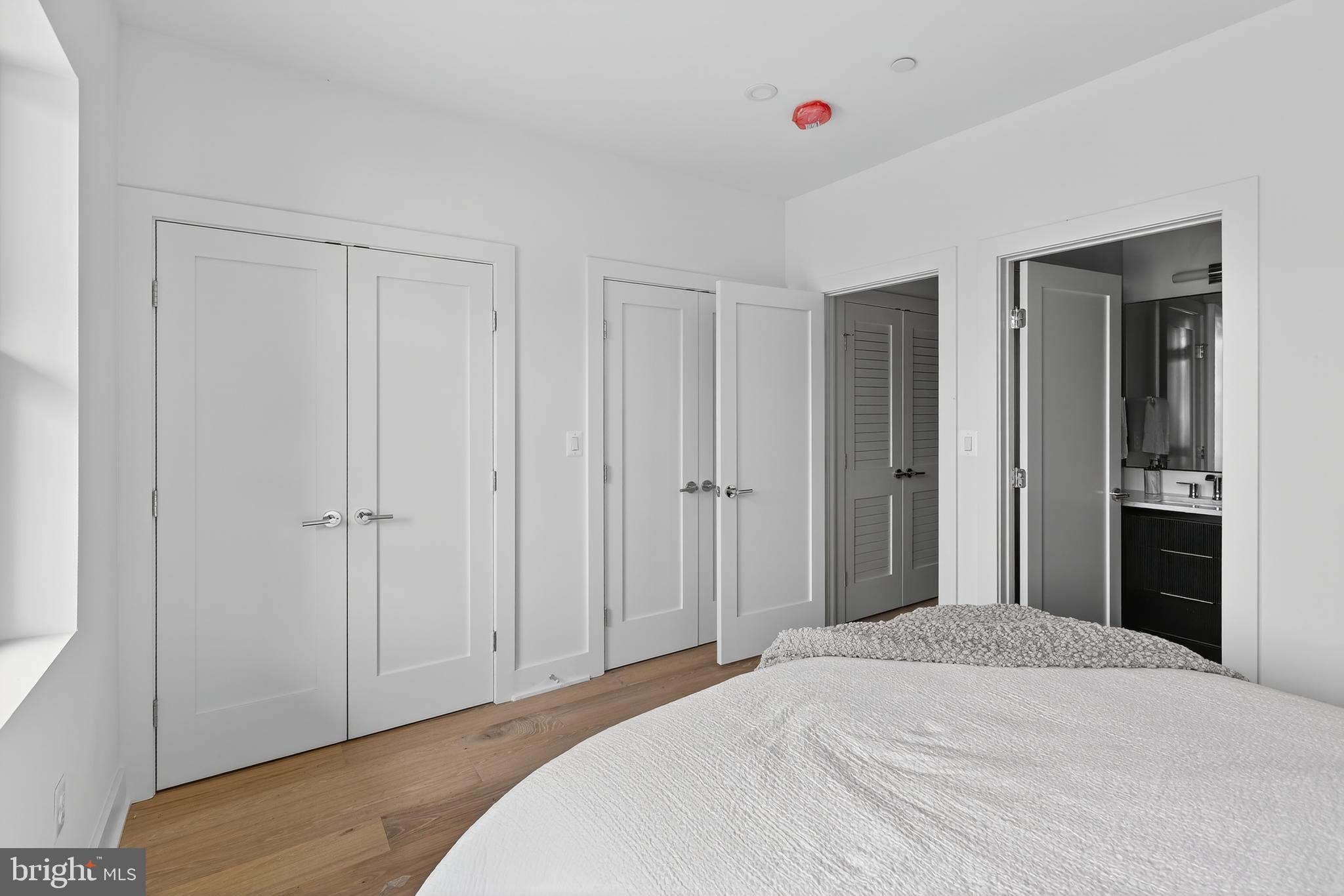 828 21st Street Northeast, Unit 1 Washington, DC 20002 - Photo 21 of 30 a bedroom with a bed and a window