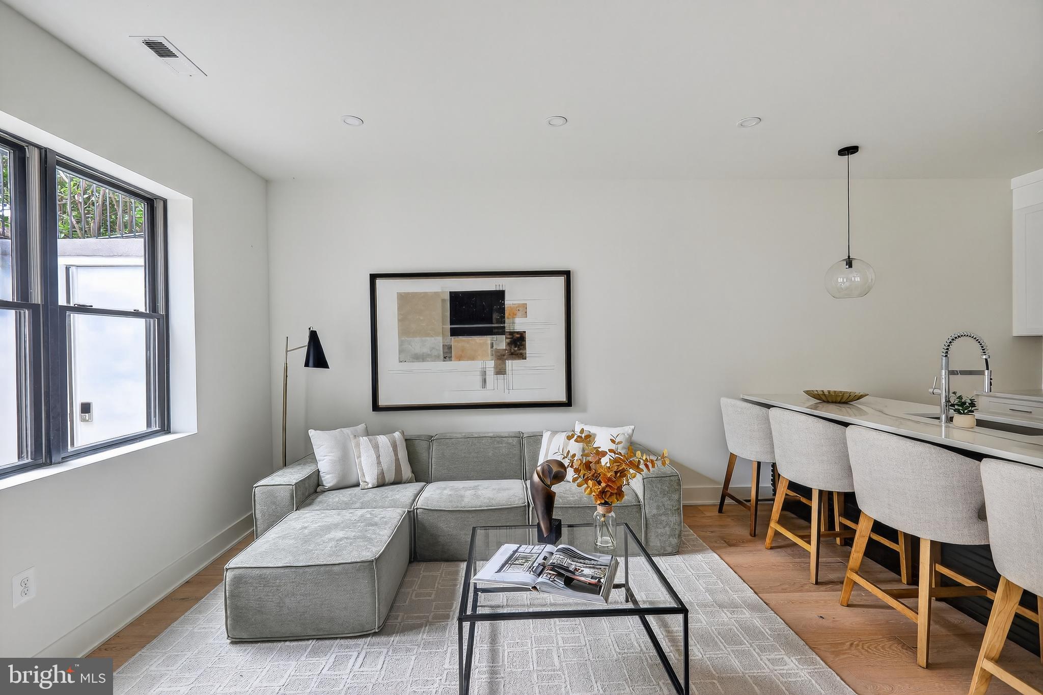 828 21st Street Northeast, Unit 1 Washington, DC 20002 - Photo 9 of 30 a living room with furniture and wooden floor