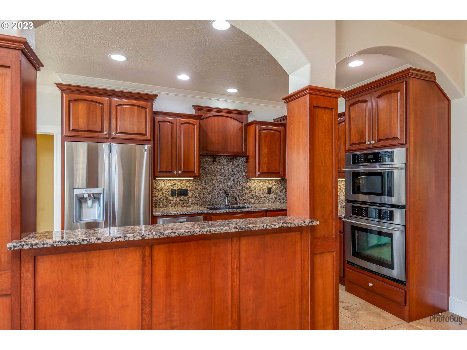 6099 Graystone Loop Springfield, OR 97478 - Photo 11 of 48 a view of kitchen with stainless steel appliances granite countertop a refrigerator and a sink