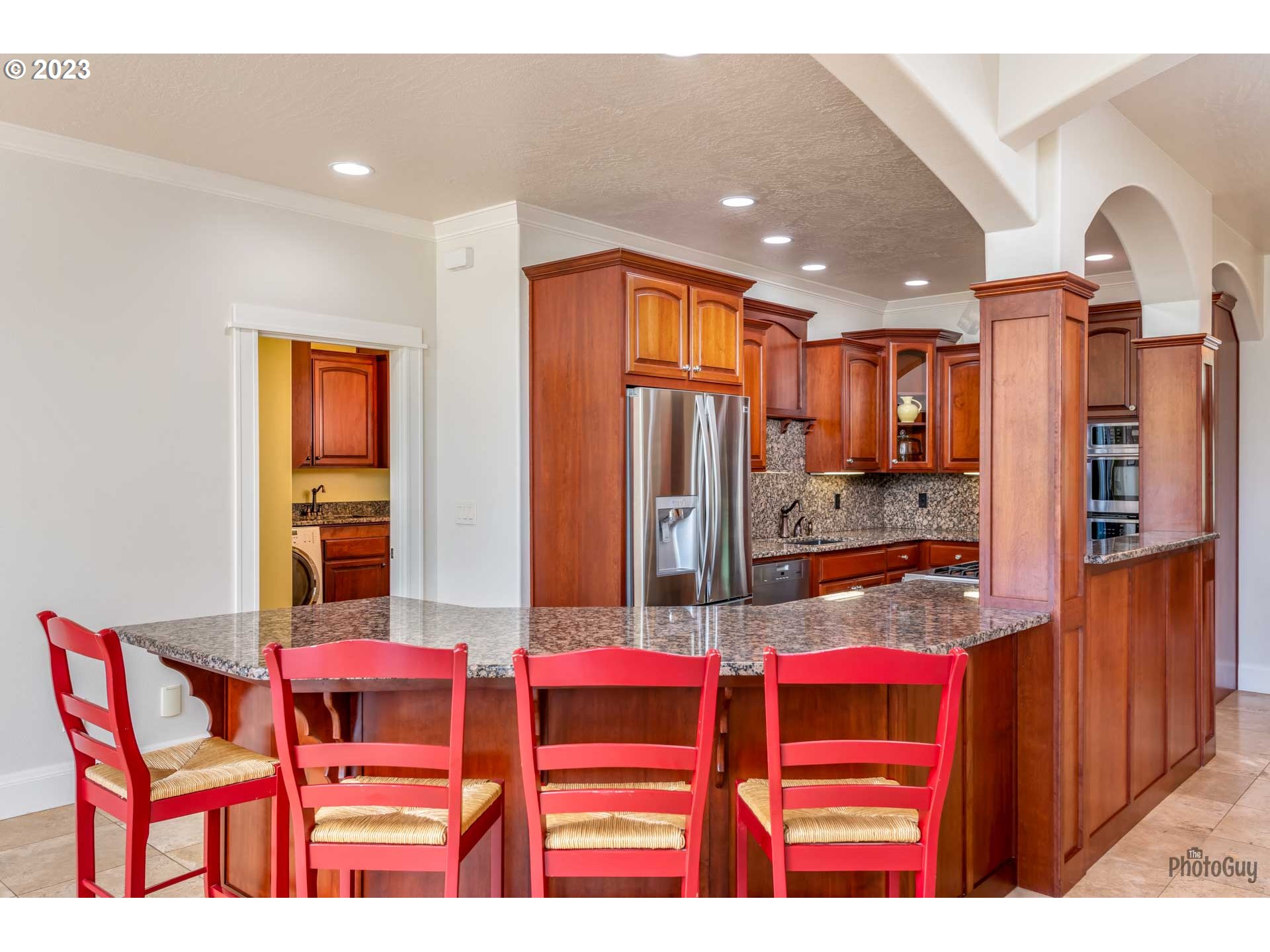 6099 Graystone Loop Springfield, OR 97478 - Photo 13 of 48 a dining room with furniture and a kitchen