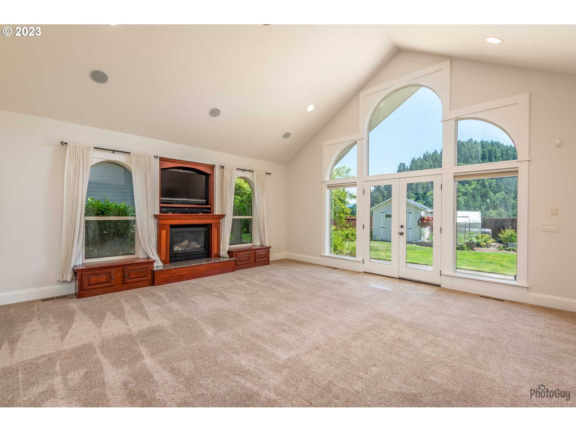 6099 Graystone Loop Springfield, OR 97478 - Photo 14 of 48 a view of an empty room with a window and fire place