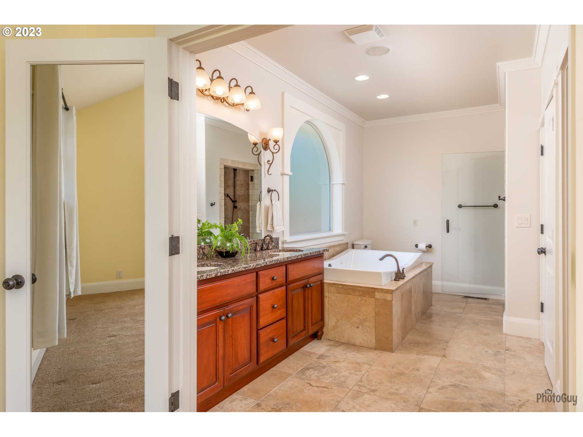 6099 Graystone Loop Springfield, OR 97478 - Photo 23 of 48 a bathroom with a double vanity sink mirror and bathtub