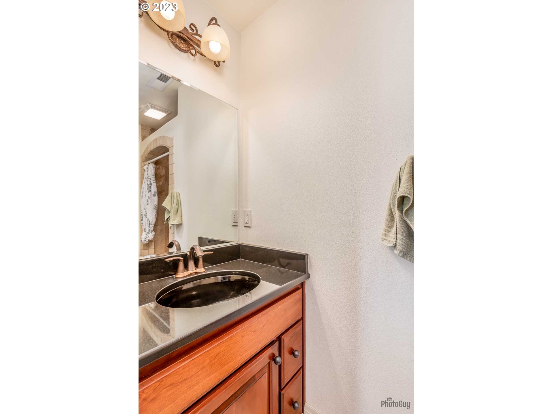 6099 Graystone Loop Springfield, OR 97478 - Photo 31 of 48 a bathroom with a sink and a mirror