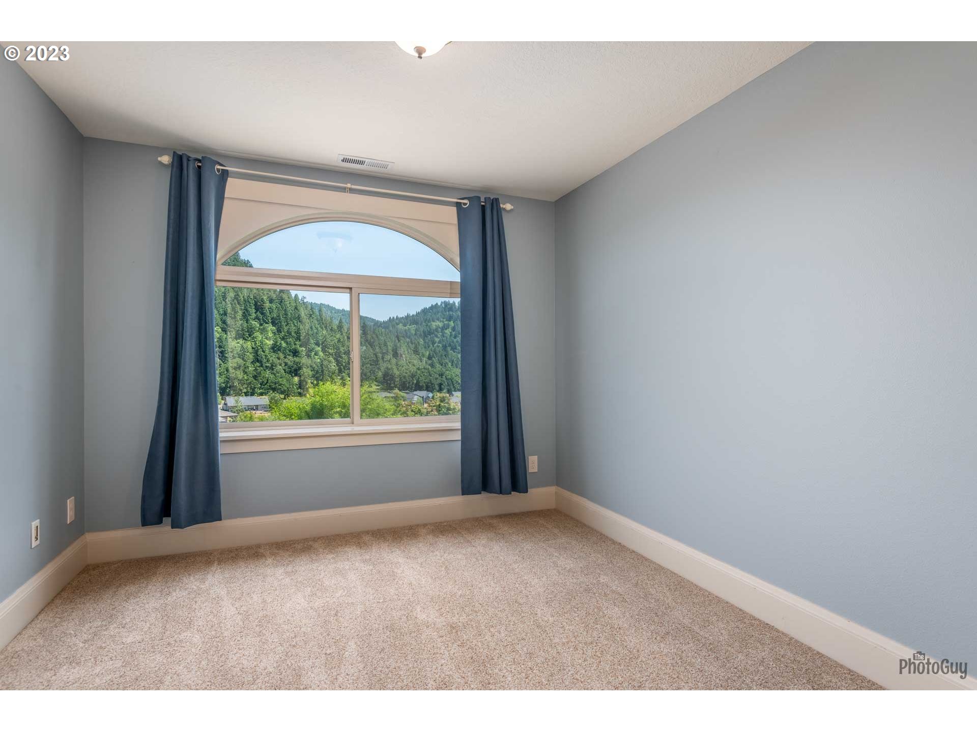 6099 Graystone Loop Springfield, OR 97478 - Photo 35 of 48 a view of an empty room with a window