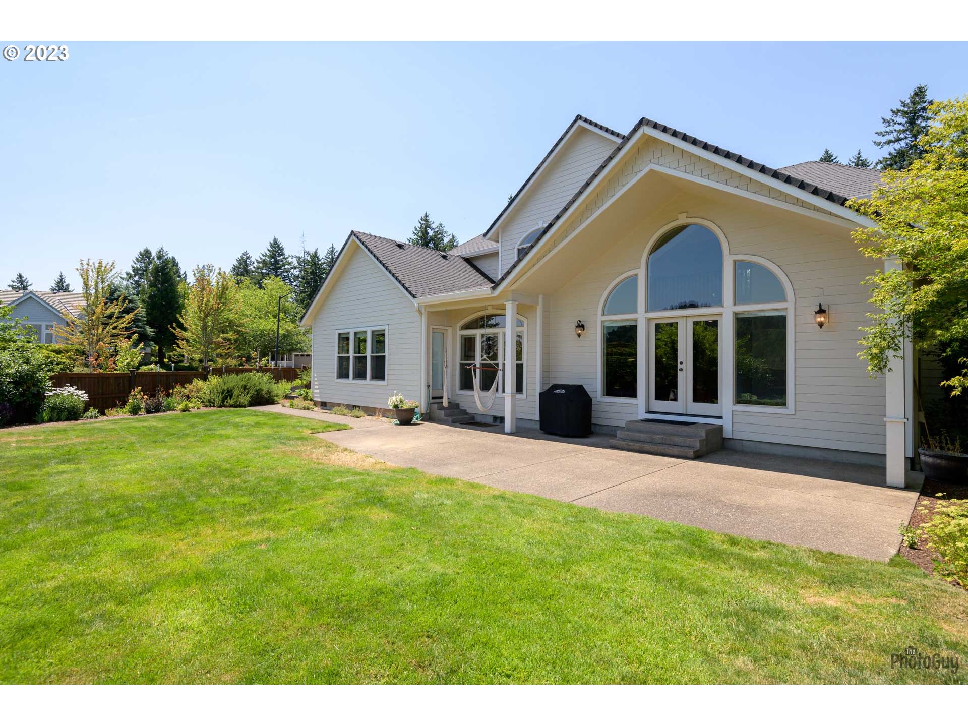 6099 Graystone Loop Springfield, OR 97478 - Photo 41 of 48 a front view of a house with a garden and yard