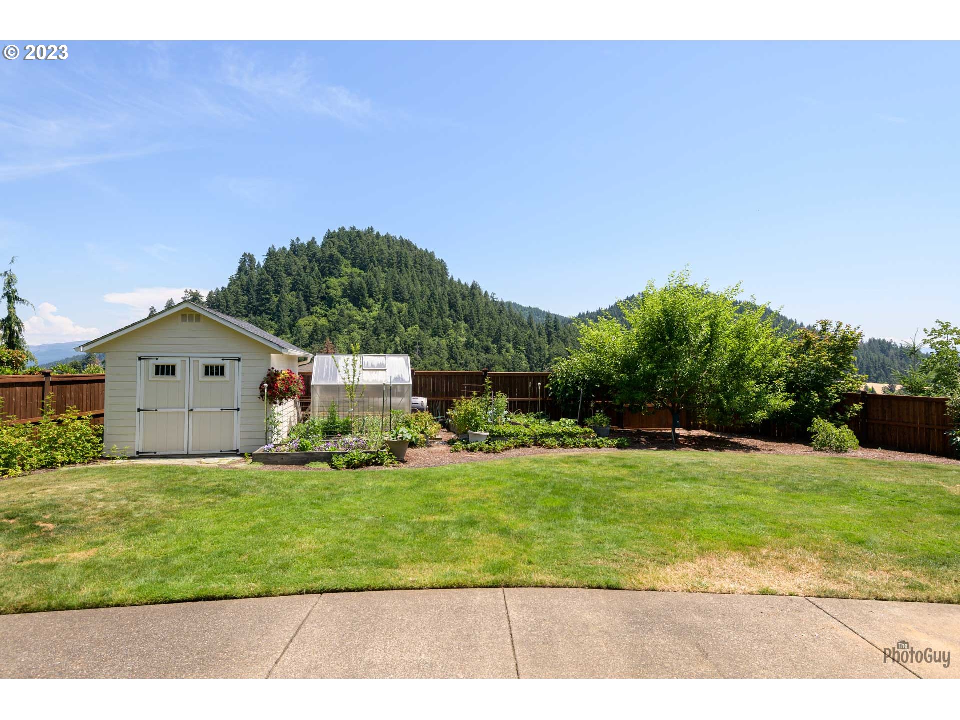 6099 Graystone Loop Springfield, OR 97478 - Photo 42 of 48 a view of a big house with a big yard and large trees