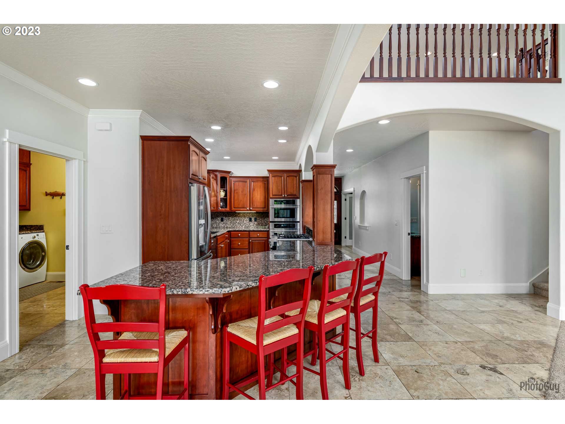 6099 Graystone Loop Springfield, OR 97478 - Photo 10 of 48 a dining room with furniture and a kitchen view