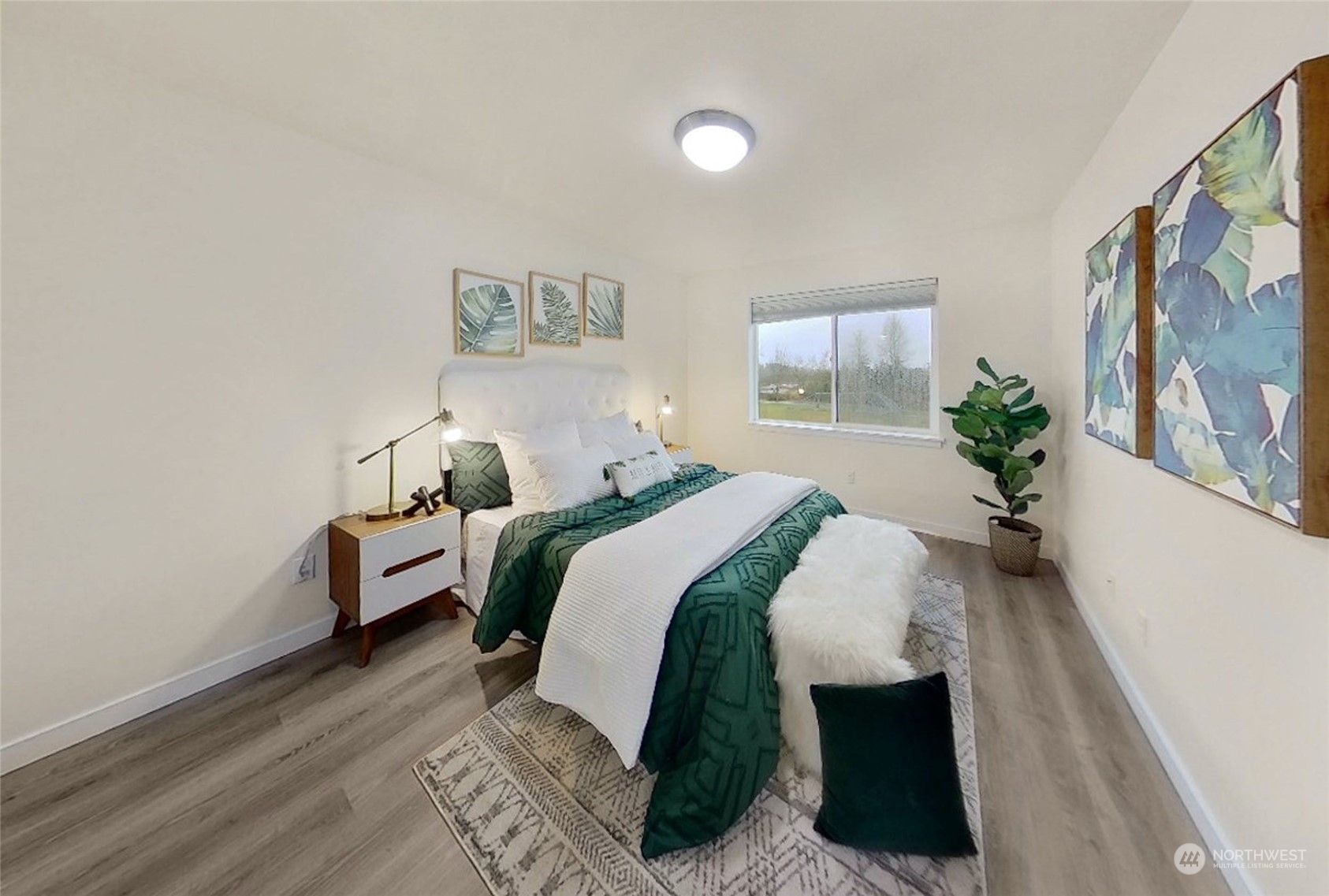 12718 35th Avenue Southeast, Unit E2 Everett, WA 98208 - Photo 16 of 28 a bed room with bed and a window