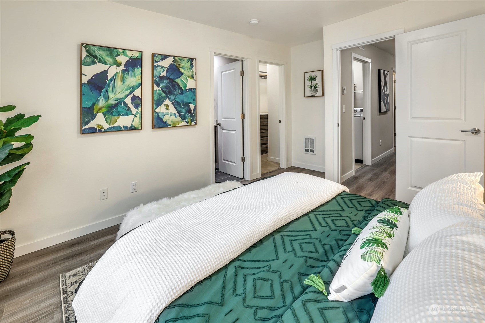 12718 35th Avenue Southeast, Unit E2 Everett, WA 98208 - Photo 17 of 28 a bedroom with a bed and a painting on the wall