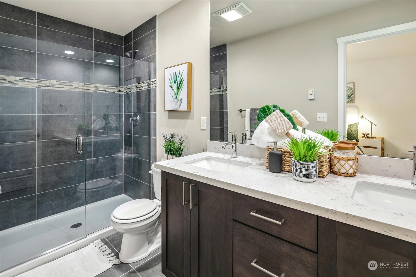 12718 35th Avenue Southeast, Unit E2 Everett, WA 98208 - Photo 18 of 28 a bathroom with a sink a toilet and shower