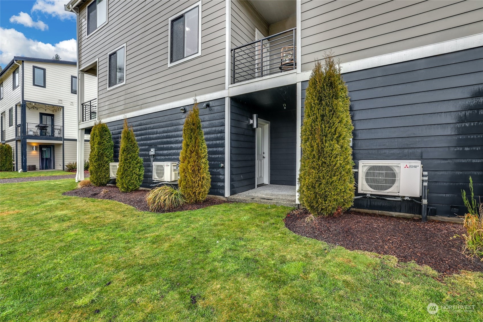 12718 35th Avenue Southeast, Unit E2 Everett, WA 98208 - Photo 28 of 28 a view of a house with backyard and porch