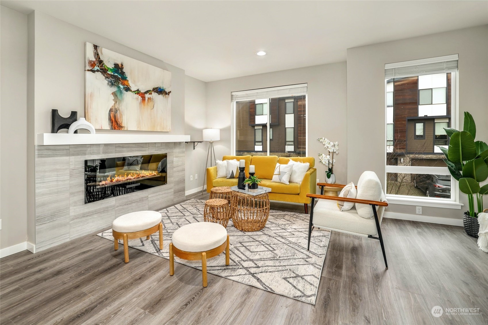 12718 35th Avenue Southeast, Unit E2 Everett, WA 98208 - Photo 6 of 28 a living room with furniture and a fireplace