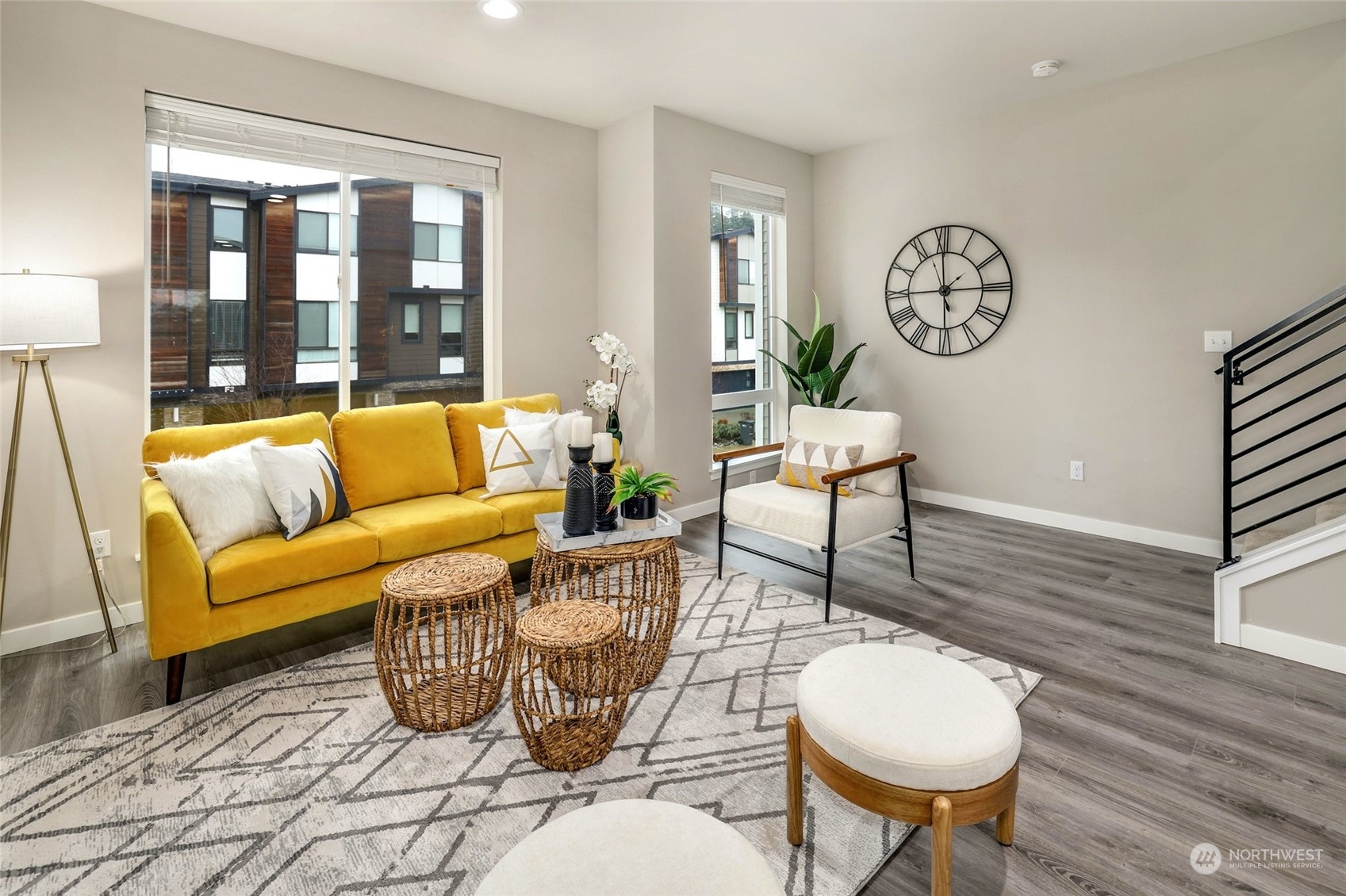 12718 35th Avenue Southeast, Unit E2 Everett, WA 98208 - Photo 7 of 28 a living room with furniture a table and a large window