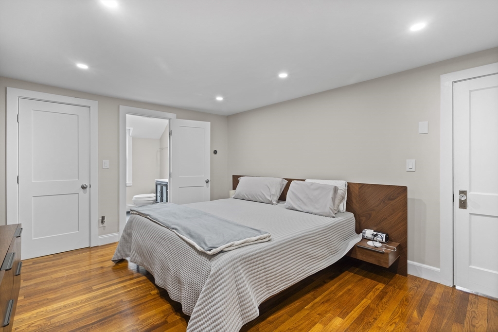 49 Jackson Road Medford, MA 02155 - Photo 23 of 36 a bed room with a bed and a couch