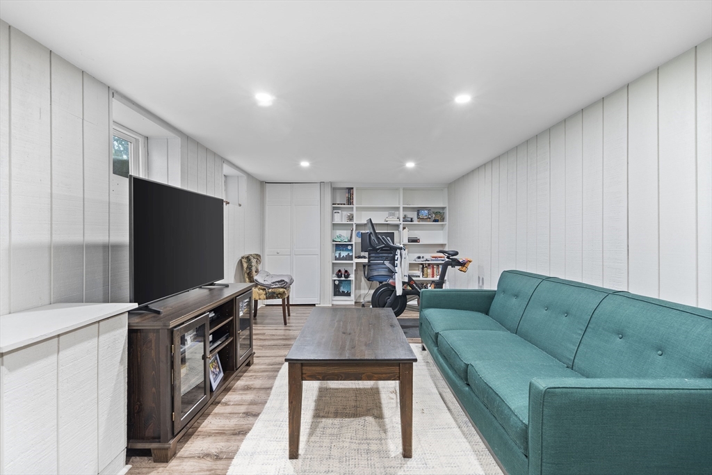 49 Jackson Road Medford, MA 02155 - Photo 33 of 36 a living room with furniture and a flat screen tv
