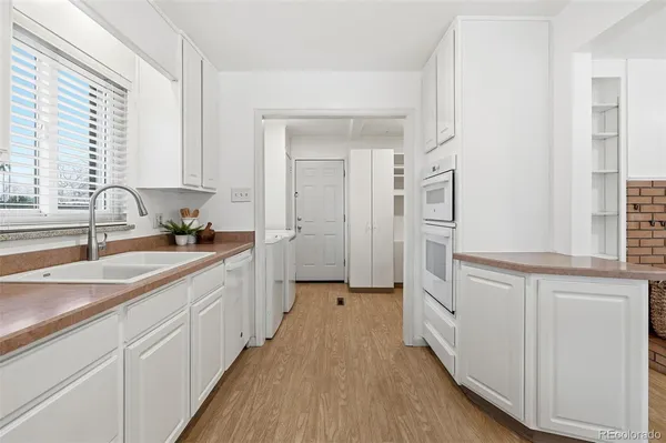 a kitchen with cabinets and a sink