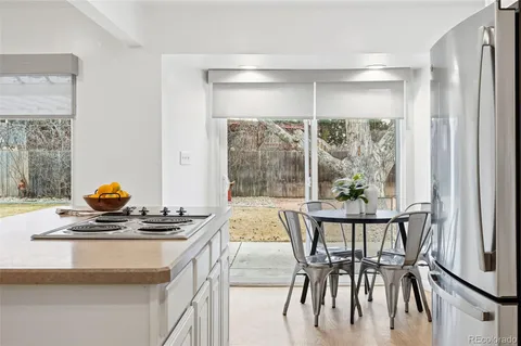 a dining room with a table and chairs