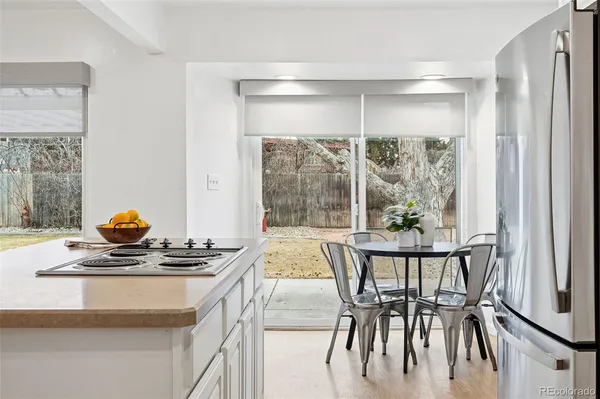 a dining room with a table and chairs