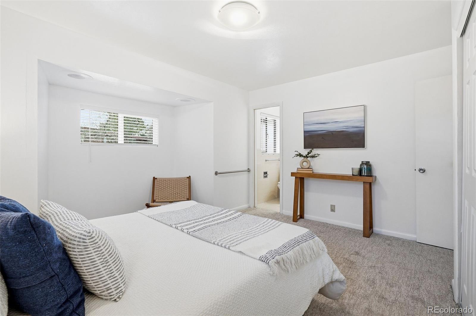 800 East Pinewood Avenue Littleton, CO 80121 - Photo 23 of 42 a bedroom with a bed and a desk
