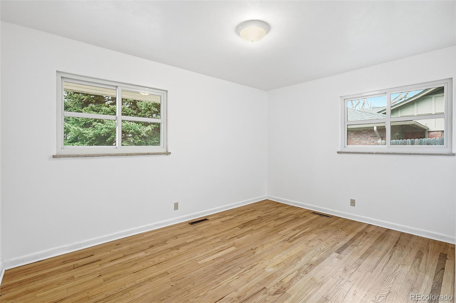 800 East Pinewood Avenue Littleton, CO 80121 - Photo 26 of 42 an empty room with a window