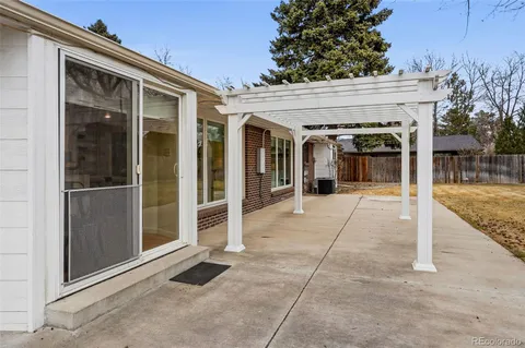 a view of a yard with a house and large tree