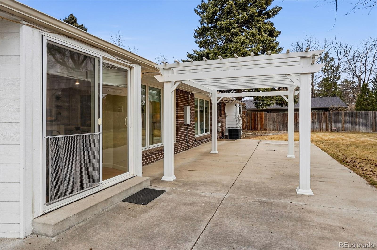 800 East Pinewood Avenue Littleton, CO 80121 - Photo 35 of 42 a view of a house with a outdoor space