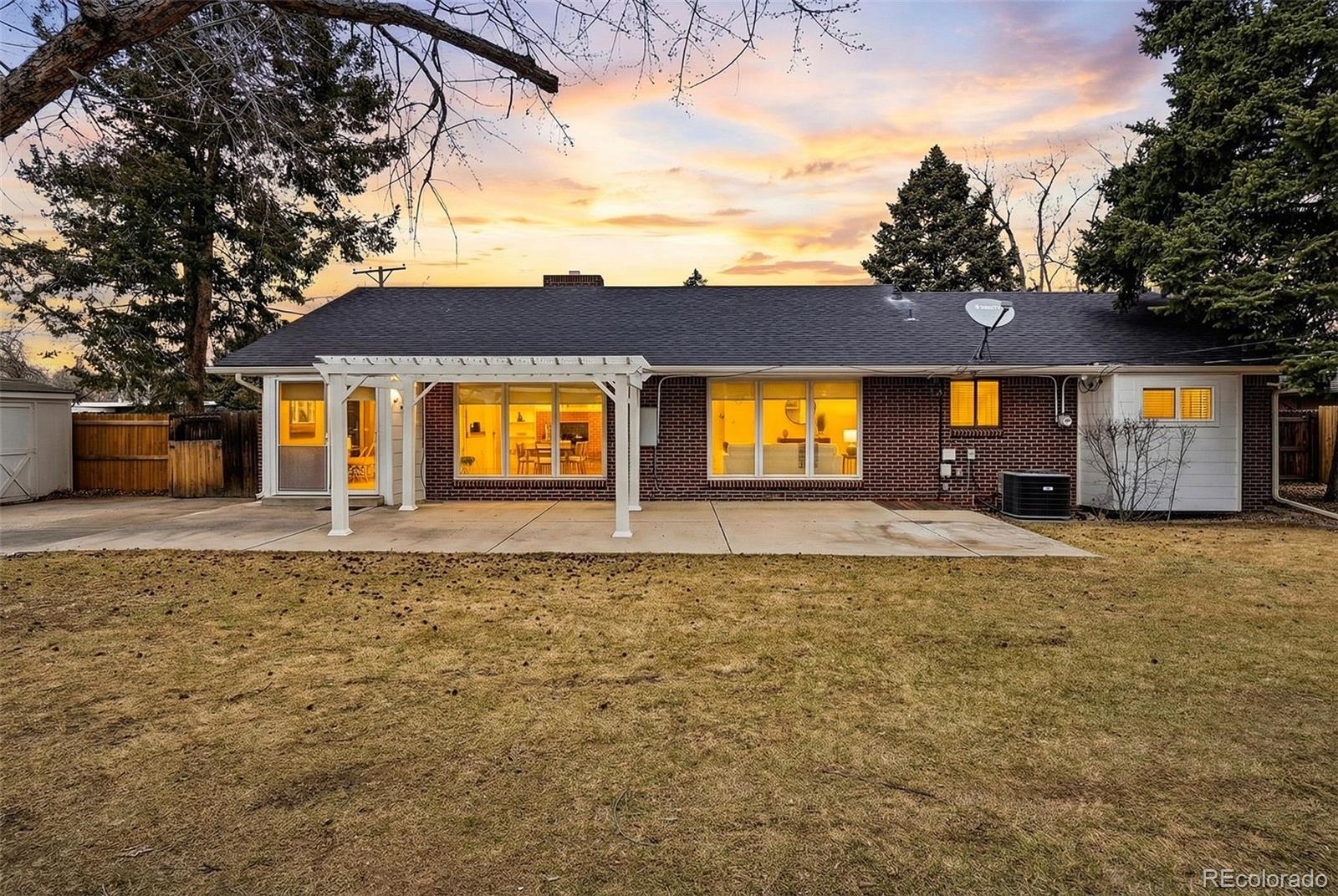 800 East Pinewood Avenue Littleton, CO 80121 - Photo 41 of 42 a front view of a house with a yard