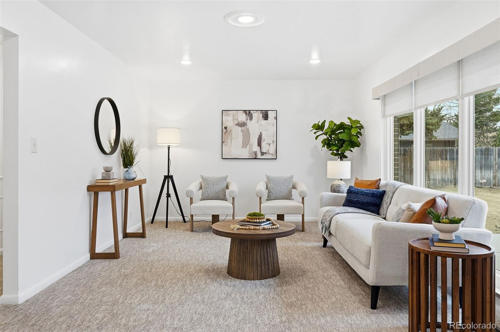 800 East Pinewood Avenue Littleton, CO 80121 - Photo 6 of 42 a living room with furniture a window and a potted plant