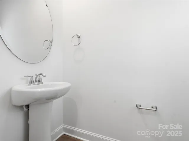 a bathroom with a sink a mirror and shower