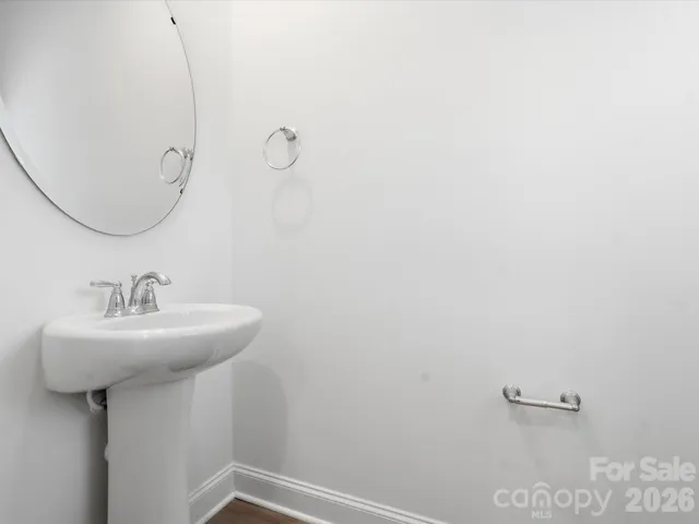a bathroom with a sink and mirror