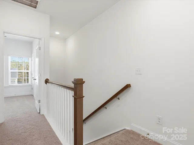 a view of a hallway with windows
