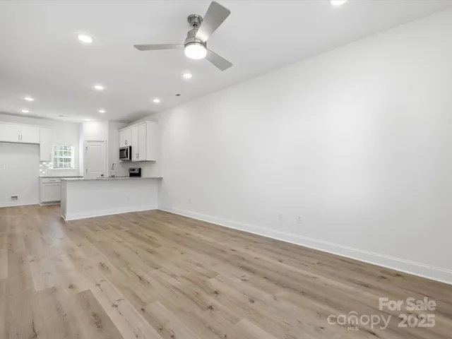 a view of kitchen with wooden floor