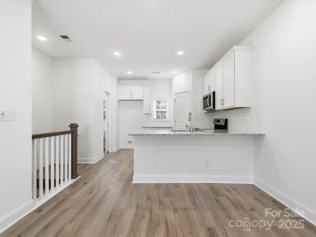 a view of kitchen with wooden floor