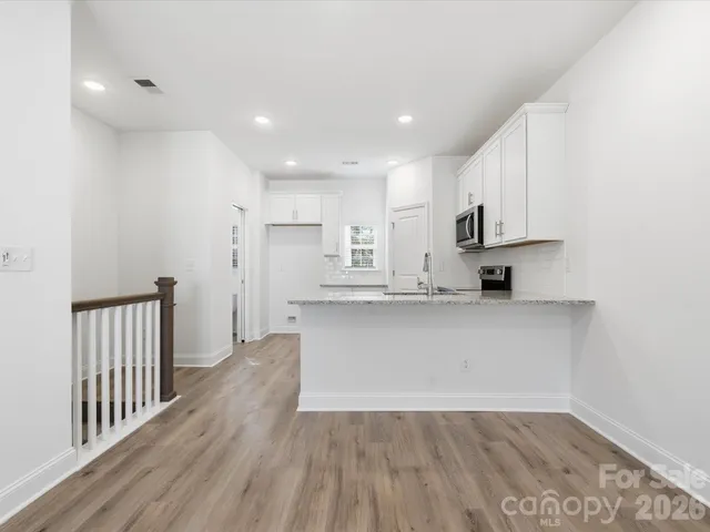 a view of kitchen with wooden floor