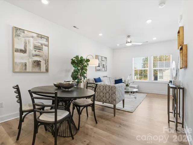 a view of a dining room with furniture window and outside view
