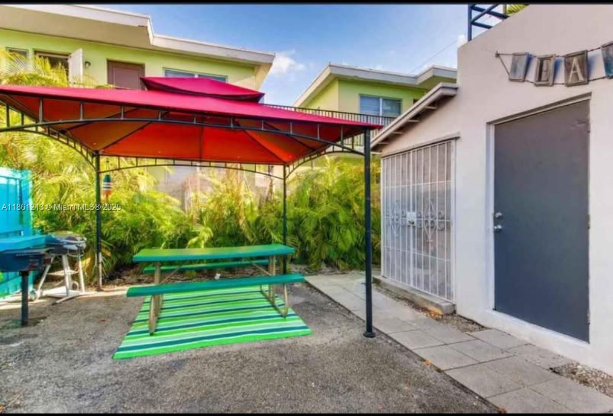 233 80th Street, Unit 1 Miami Beach, FL 33141 - Photo 2 of 24 a view of outdoor space yard and patio