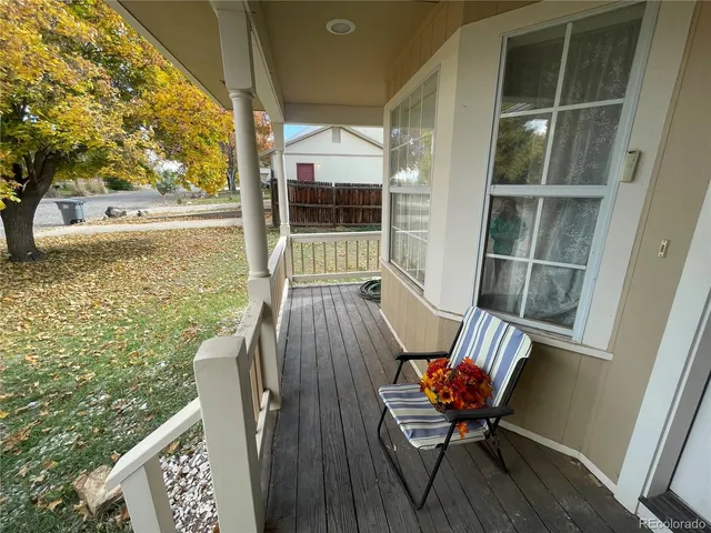 a view of a balcony with furniture