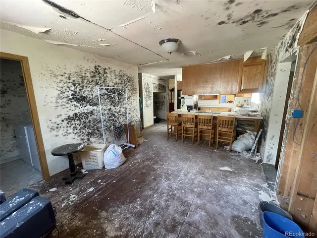 a view of a hallway with wooden shelves
