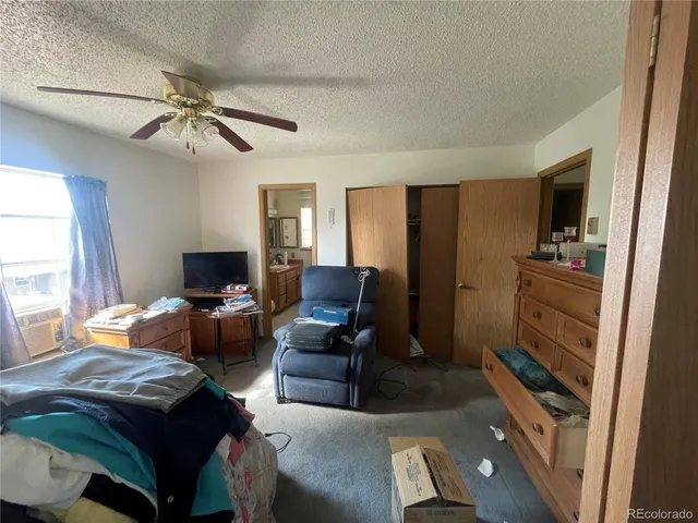 a living room with furniture a chandelier and a window
