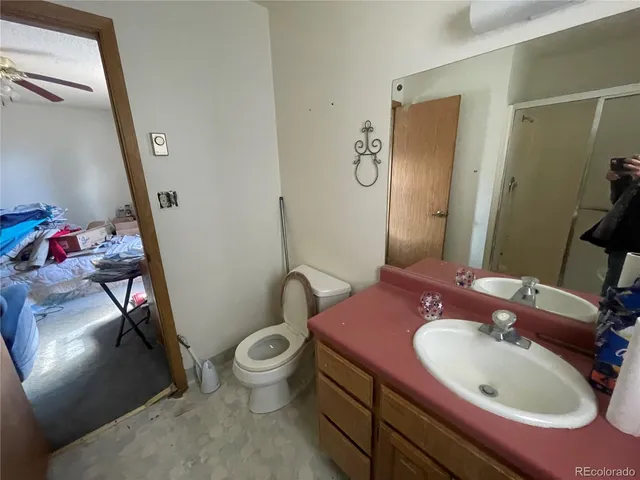 a bathroom with a shower and toilet