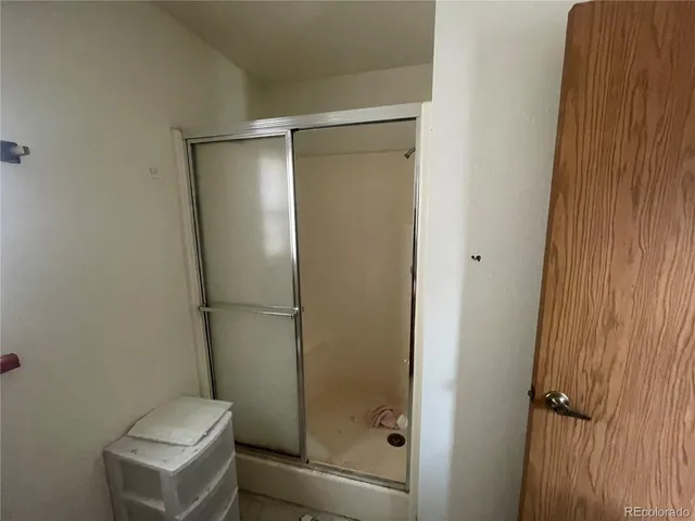 a bathroom with a sink toilet and mirror